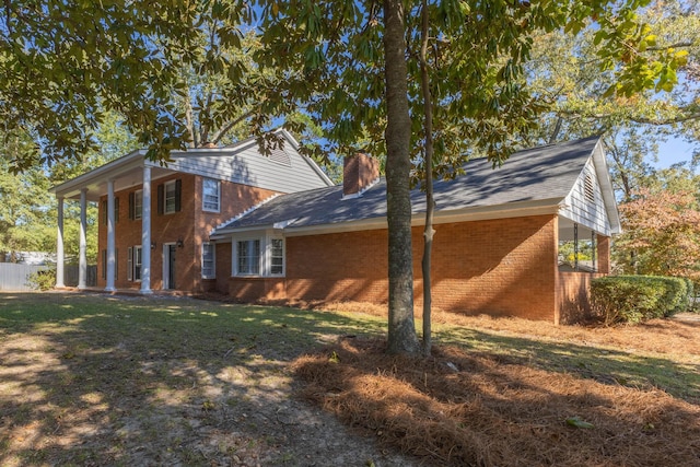 view of property exterior featuring a yard