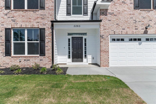 5065 Anna Way Unit Fb25, North Augusta, SC 29841 - view of exterior entry featuring driveway, brick siding, and a lawn