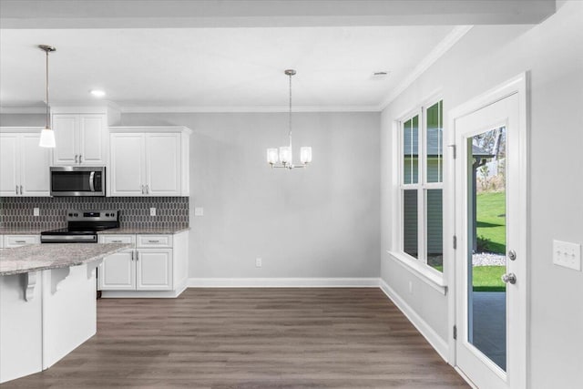 5065 Anna Way Unit Fb25, North Augusta, SC 29841 - kitchen with appliances with stainless steel finishes, crown molding, a chandelier, white cabinetry, and tasteful backsplash