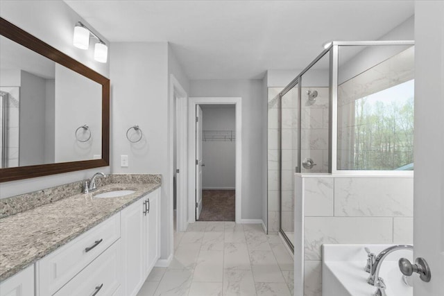 5065 Anna Way Unit Fb25, North Augusta, SC 29841 - full bathroom with marble finish floors, a stall shower, vanity, a garden tub, and a walk in closet