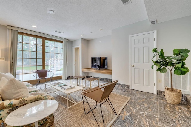 living room featuring a textured ceiling