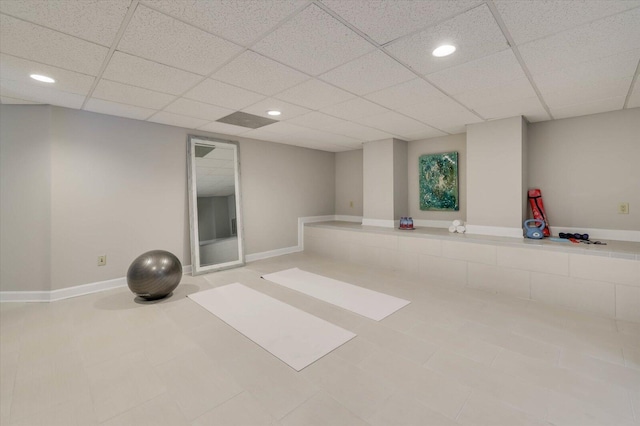 workout area with a paneled ceiling