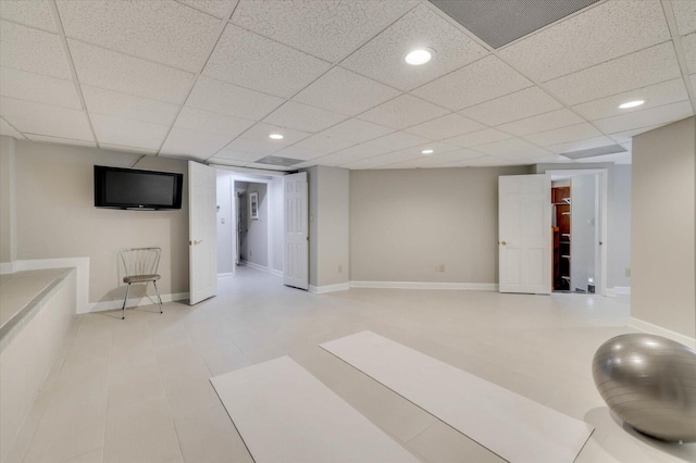 workout room featuring a paneled ceiling