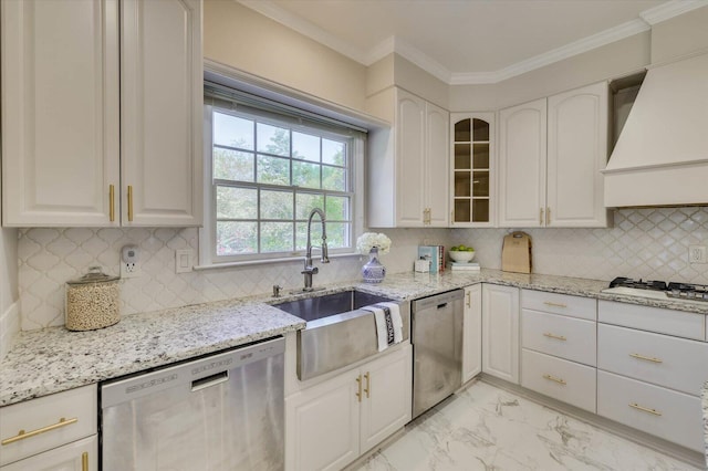 kitchen with white cabinets, custom range hood, and stainless steel dishwasher