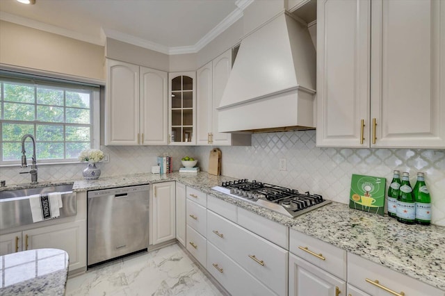 kitchen featuring white cabinets, sink, stainless steel appliances, and custom exhaust hood