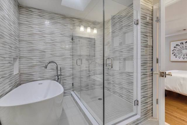 bathroom with tile patterned flooring, separate shower and tub, and ornamental molding