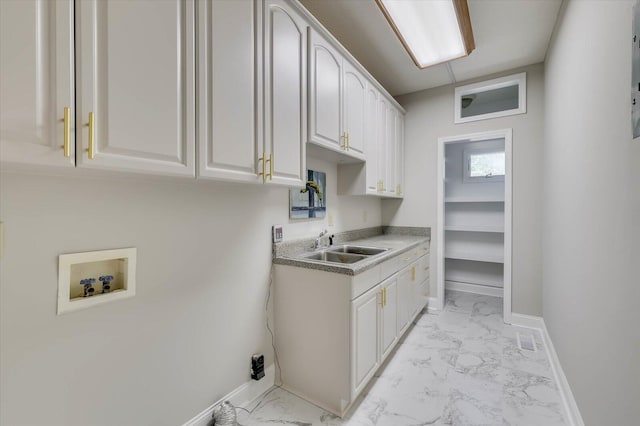 kitchen with white cabinets and sink