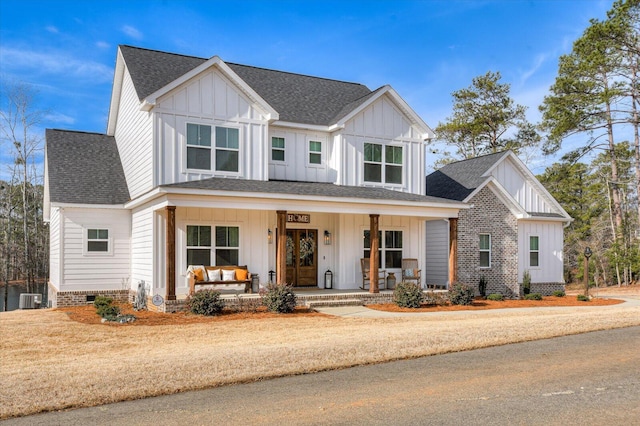 view of front of property featuring central AC and covered porch