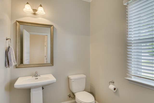 bathroom featuring toilet and sink