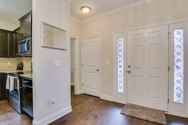 entryway with crown molding and dark hardwood / wood-style floors