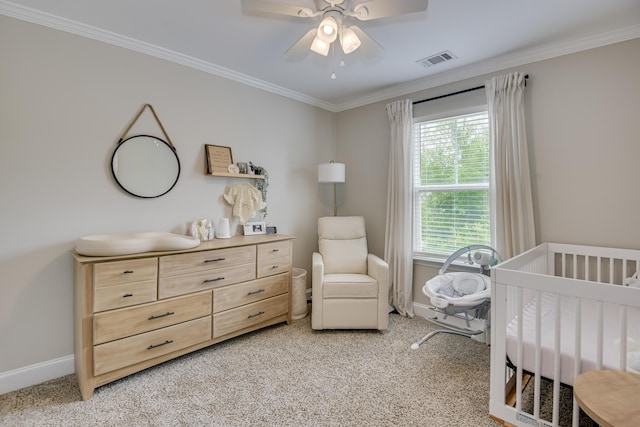 carpeted bedroom featuring multiple windows, crown molding, a nursery area, and ceiling fan