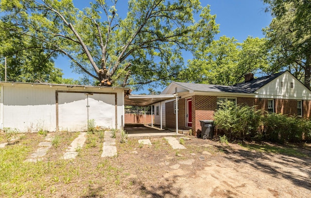 view of property exterior with a carport