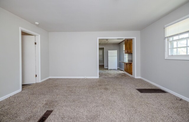 empty room with light colored carpet