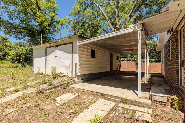 view of vehicle parking with a carport