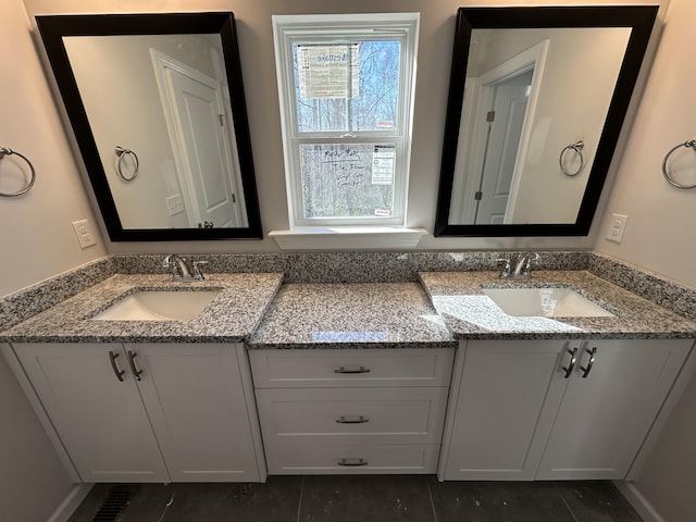 bathroom with vanity and tile patterned flooring