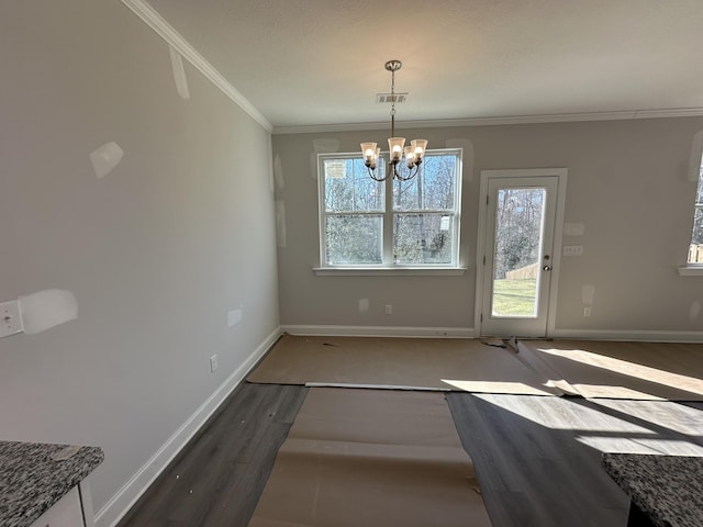 unfurnished dining area with ornamental molding, a chandelier, and dark hardwood / wood-style floors