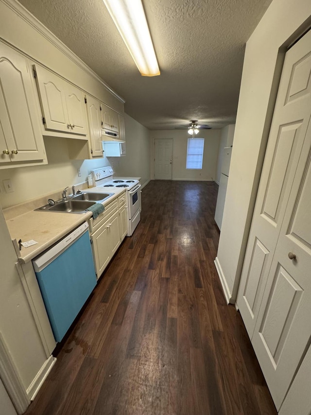 kitchen with a textured ceiling, white appliances, ceiling fan, dark wood-type flooring, and sink