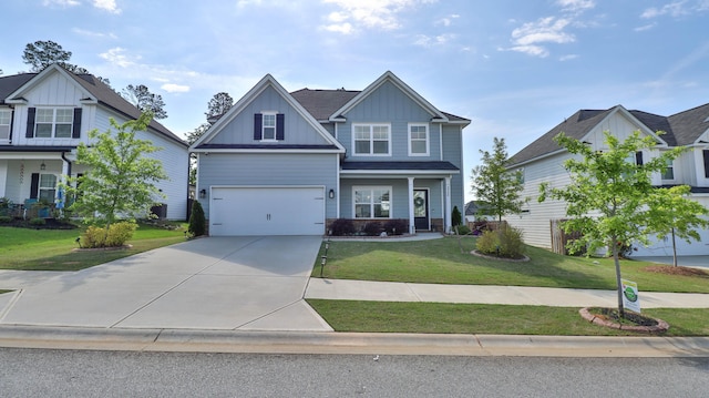 craftsman-style home featuring board and batten siding, concrete driveway, a front lawn, and a garage