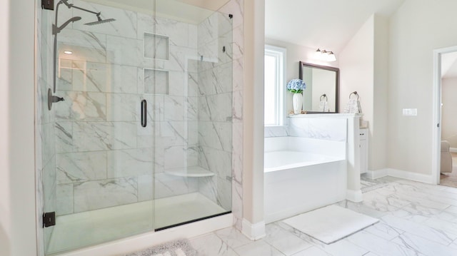 bathroom featuring a garden tub, a shower stall, vanity, baseboards, and marble finish floor