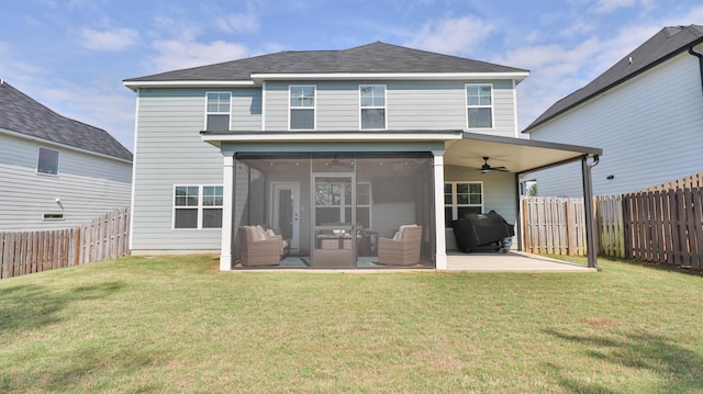 rear view of property featuring a sunroom, a ceiling fan, a fenced backyard, and a patio