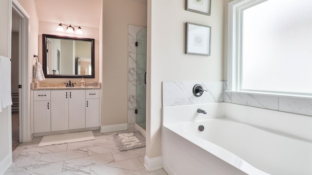full bath with vanity, a garden tub, marble finish floor, baseboards, and a shower stall