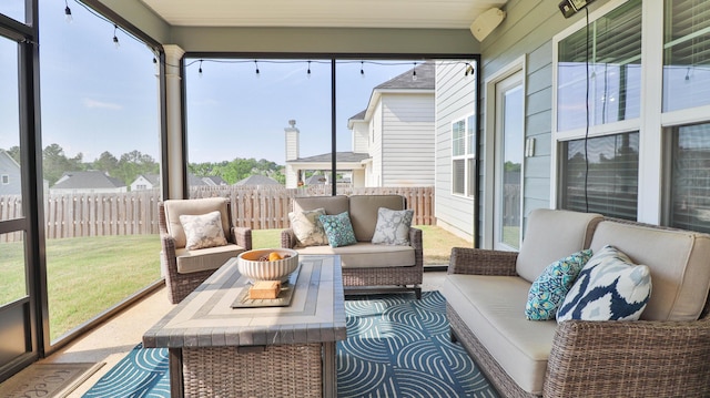 sunroom featuring outdoor lounge area and a wealth of natural light