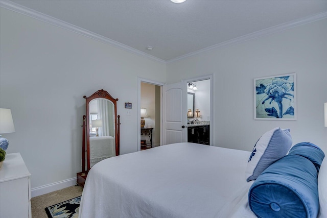 bedroom featuring light colored carpet, ensuite bathroom, baseboards, and ornamental molding