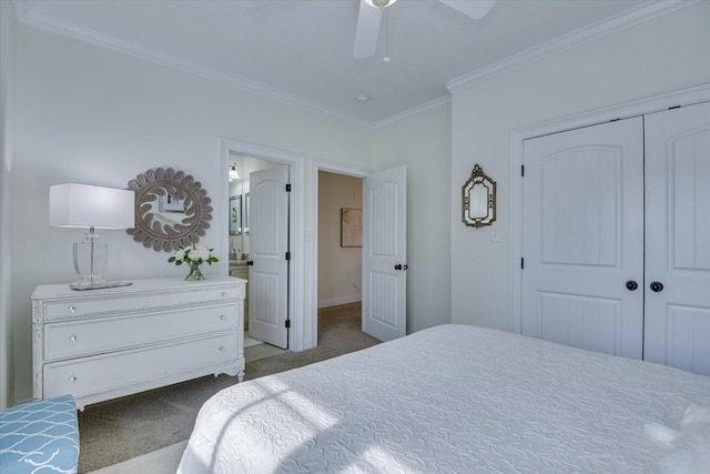 bedroom featuring ornamental molding, ensuite bathroom, a ceiling fan, a closet, and carpet flooring