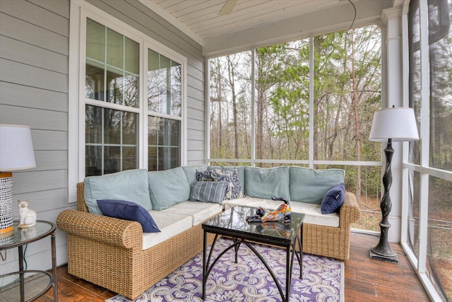 sunroom / solarium featuring wood ceiling