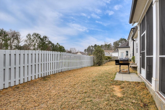 view of yard with a patio and a fenced backyard