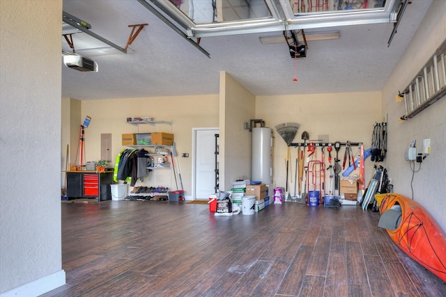 garage with electric panel and a garage door opener