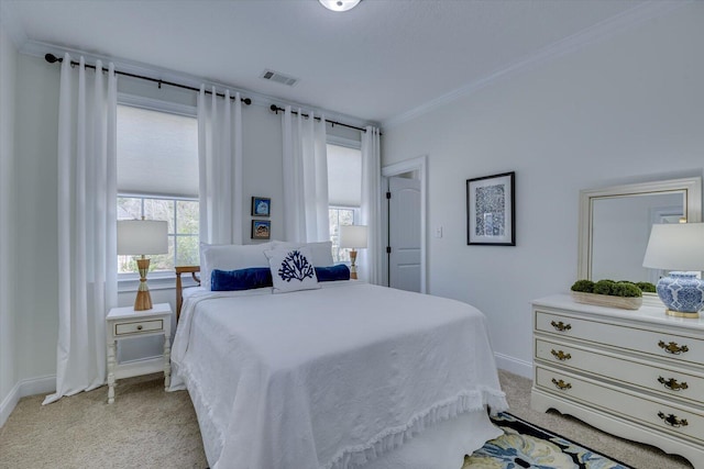 bedroom with light carpet, visible vents, baseboards, and ornamental molding