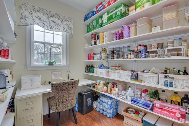 home office featuring wood finished floors and built in study area