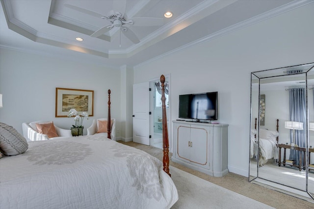 bedroom with crown molding, light colored carpet, baseboards, and a raised ceiling