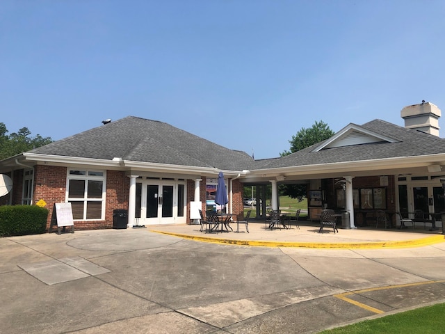 405 Sawgrass Cv, Mccormick, SC 29835 - back of house with brick siding, french doors, roof with shingles, and a patio