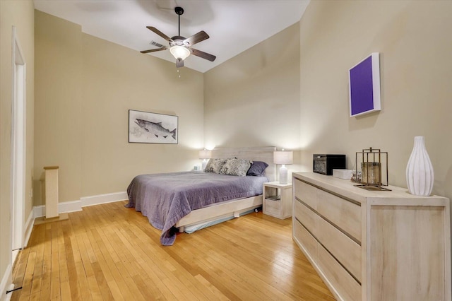 bedroom with light wood-type flooring and ceiling fan