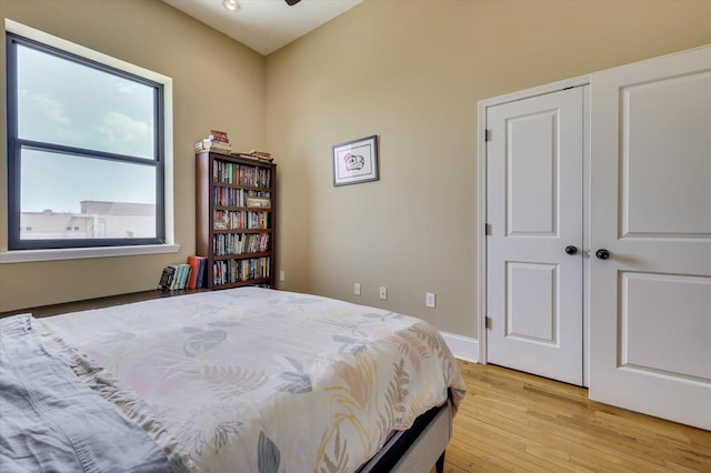 bedroom featuring light hardwood / wood-style floors and a closet