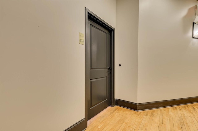 hall with light hardwood / wood-style flooring