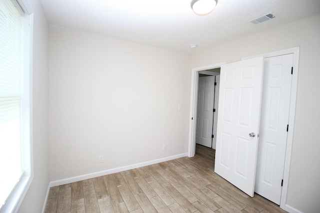 3629 Meadowgrove Dr, Augusta, GA 30906 - unfurnished bedroom featuring baseboards, visible vents, and light wood-style floors