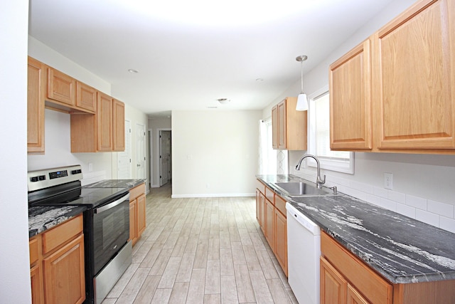 3629 Meadowgrove Dr, Augusta, GA 30906 - kitchen featuring white dishwasher, stainless steel electric range, a sink, baseboards, and light wood-type flooring