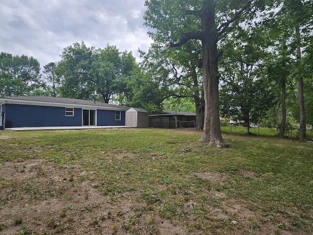 3629 Meadowgrove Dr, Augusta, GA 30906 - view of yard with an outdoor structure, a shed, and fence