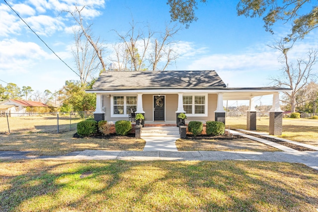 view of front facade featuring covered porch and a front lawn