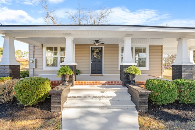 doorway to property featuring a porch and ceiling fan