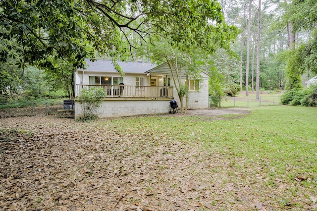 rear view of house featuring crawl space