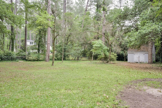 view of yard featuring a storage unit and an outdoor structure
