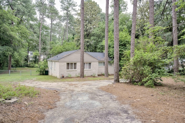 view of home's exterior with fence