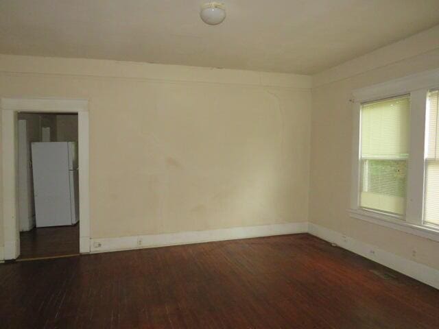 1307 Beman St, Augusta, GA 30904 - spare room featuring dark wood finished floors and baseboards