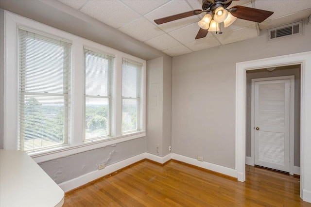 2068 Walton Way, Augusta, GA 30909 - spare room featuring a drop ceiling, wood finished floors, and a ceiling fan