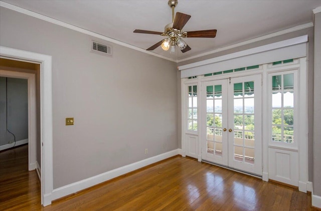2068 Walton Way, Augusta, GA 30909 - empty room featuring french doors, healthy amount of natural light, wood finished floors, ornamental molding, and a ceiling fan