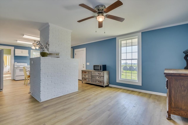 interior space featuring light hardwood / wood-style floors, ceiling fan, and crown molding